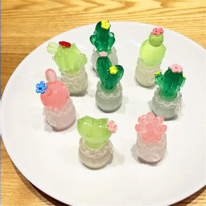 DecorBites luminous resin cactus miniatures featuring colorful translucent cactus figurines with lace bases and flower accents