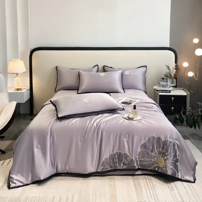 Lavender satin quilt set with black lace trim and embroidered floral design from decorbites luxe flower embroidered collection