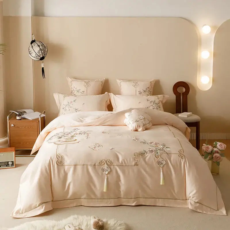 Beige satin bedding set with intricate floral embroidery and tassels made from Egyptian cotton by DecorBites Luxe Flowers