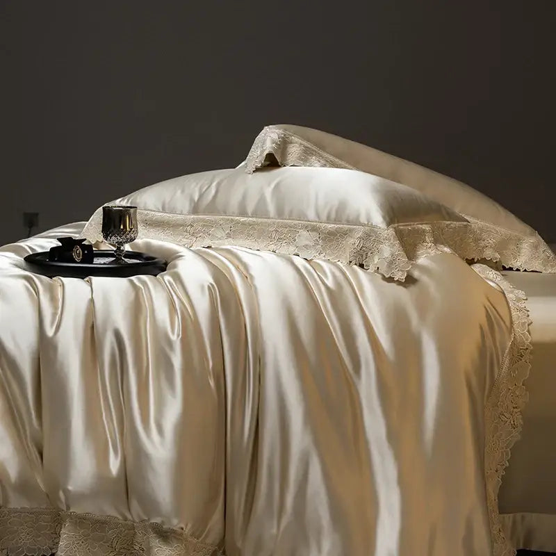 Cream-colored satin bedding set with delicate luxe french lace trim made from silky lyocell cotton by decorbites luxe french