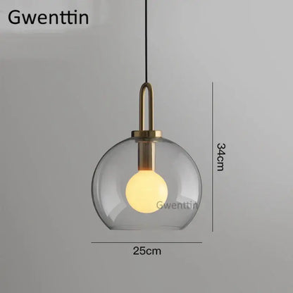 Decorbites luxe glass ball pendant light with frosted gray glass and brass hardware for modern home decor