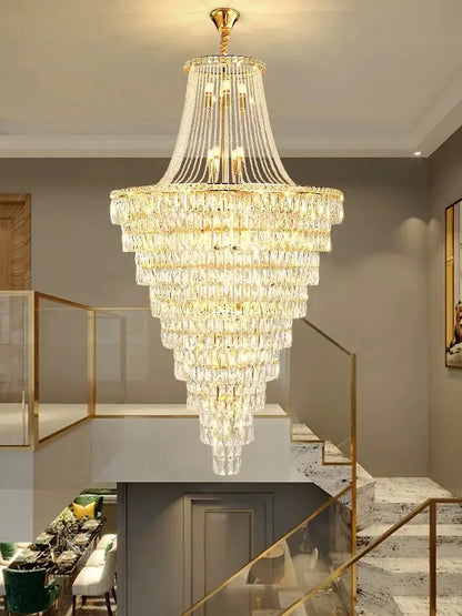 A decorbites luxe golden crystal chandelier with gold metal frame and clear faceted crystals for lobby and living room