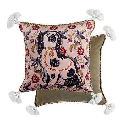 Pink velvet decorative pillow cover featuring an embroidered black and white dog with floral patterns and cream tassels