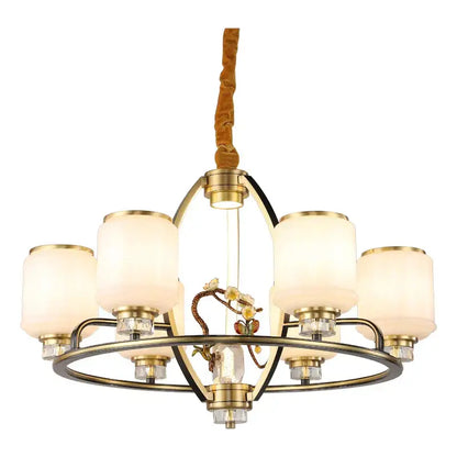 Brass-finished decorbites luxe jade chandelier with five frosted glass shades and central floral ornament for living room