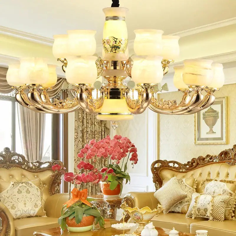 Gold-toned decorbites luxe jade copper living room chandelier with ornate detailing and frosted glass shades