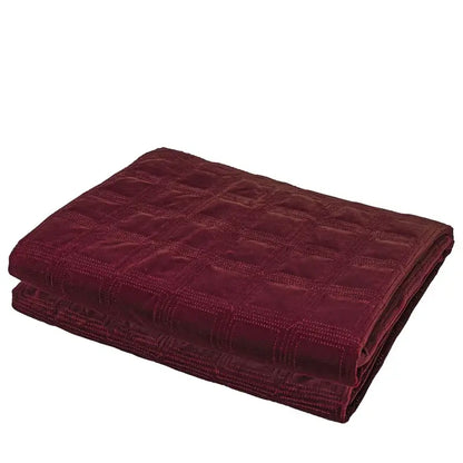 A plush deep burgundy velvet throw blanket with a quilted grid pattern complements decorbites luxe linen blend cushion covers