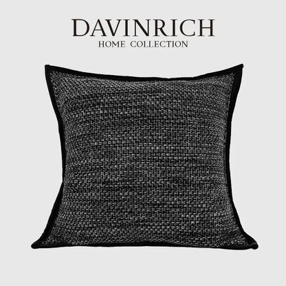 Black textured throw pillow with woven fabric and contrasting trim from decorbites luxe linen blend cushion covers set