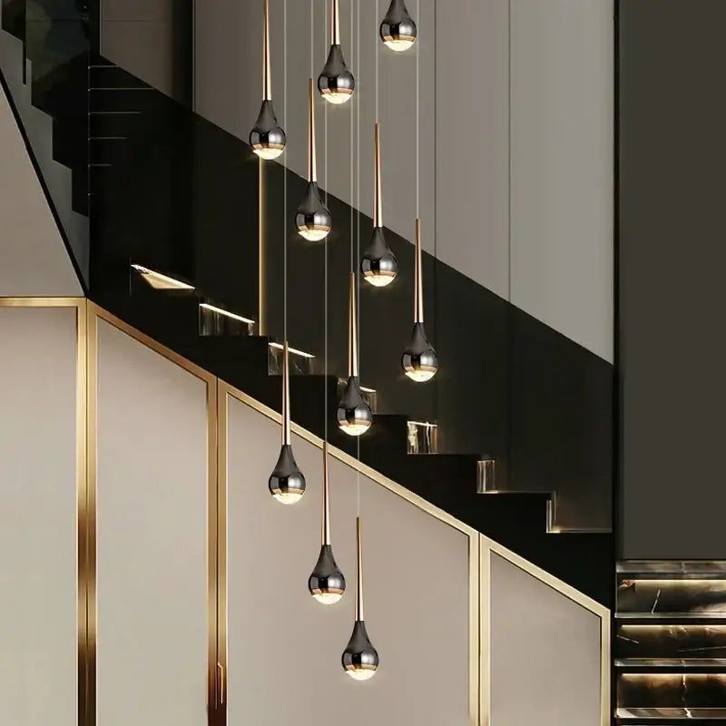 Modern chrome-finished teardrop pendant lights in a cascading design for decorbites luxe loft chandelier in living spaces