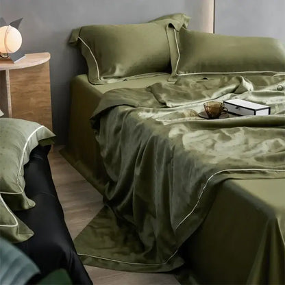 Olive green satin decorbites luxe lyocell summer blanket with mulberry silk fill and subtle white piping edges