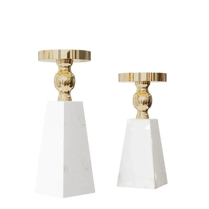 Elegant gold-toned decorbites™ luxe marble candle holder with polished metallic tops and white marble bases
