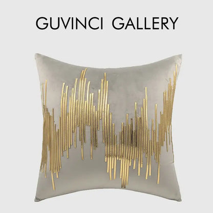 A square gray velvet cushion cover with luxe metallic stripes in gold by decorbites featuring an abstract wave design
