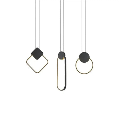 Set of three matte black and gold pendant light fixtures with geometric shapes in the decorbites luxe nordic circle lamp collection