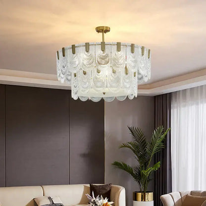 A modern decorbites luxe palace ceiling chandelier with layered translucent glass and gold-toned metal accents
