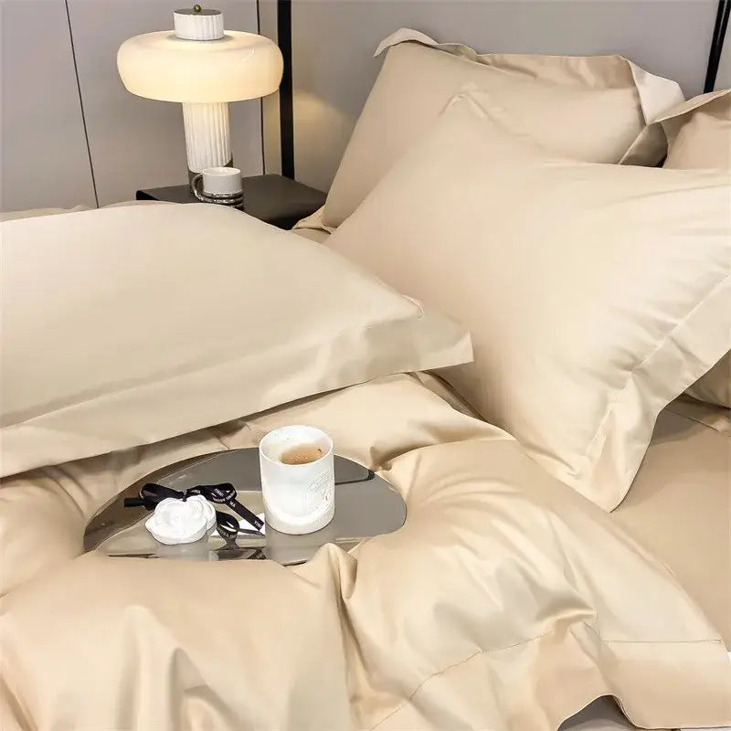 Cream-colored satin duvet cover and fitted sheet set with pleated pillowcases from decorbites™ luxurious 1000tc egyptian cotton bedding set