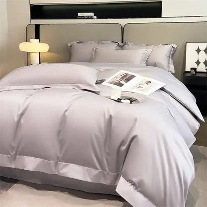 Luxury gray satin piece duvet cover and fitted sheet set with smooth glossy finish and elegant stitched detailing by DecorBites