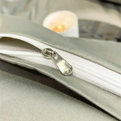 Silver-toned zipper pull on a light gray satin piece duvet cover from decorbites™ luxurious 1000tc egyptian cotton bedding set