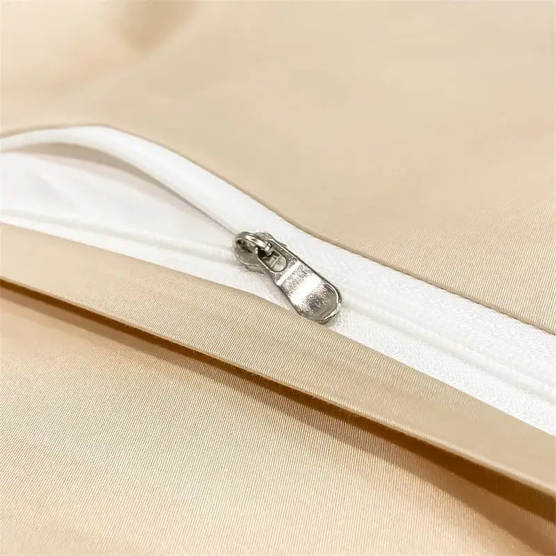 A sleek silver zipper on the beige satin pillowcase of the decorbites™ luxurious 1000tc egyptian cotton duvet cover