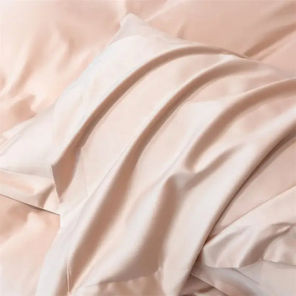 A soft blush pink satin pillowcase with gentle folds from the decorbites luxurious 1000tc egyptian cotton bedding set