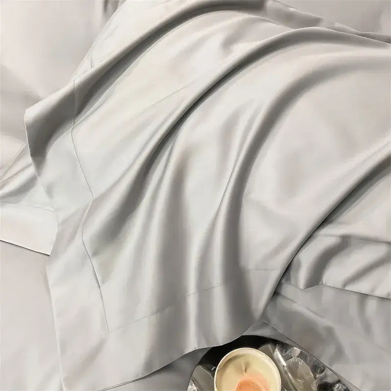A soft light gray satin fitted sheet from the decorbites™ luxurious 1000tc egyptian cotton bedding set with subtle sheen