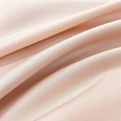 Soft peach satin fabric of the decorbites luxurious 1000tc egyptian cotton duvet cover with subtle glossy sheen