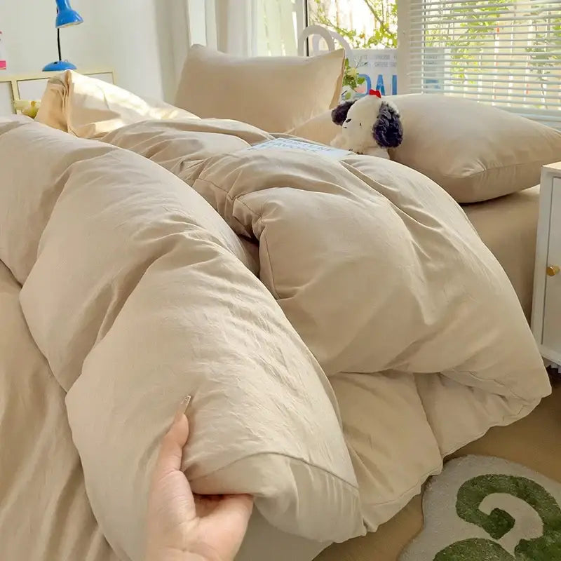 Beige plush quilted comforter with soft puffy texture and subtle stitching in decorbites luxurious cotton bedding set