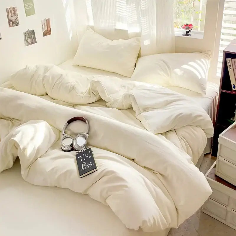 Cream-colored plush quilted decorbites™ 4-piece cotton bedding set with soft cotton fabric and matching pillows