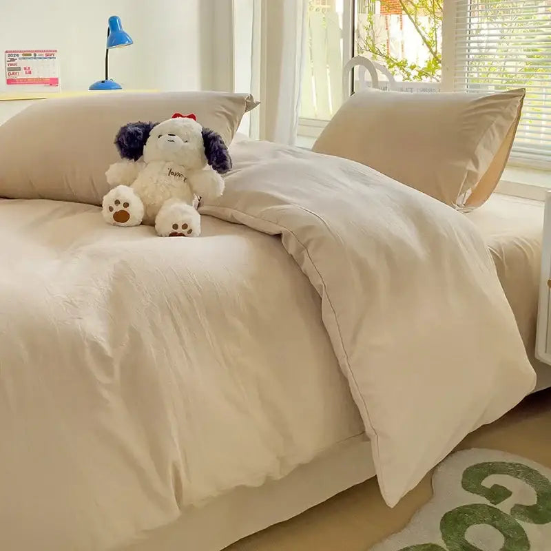Cream-colored soft textured cotton bedding set with matching pillowcases from decorbites luxurious 4-piece set