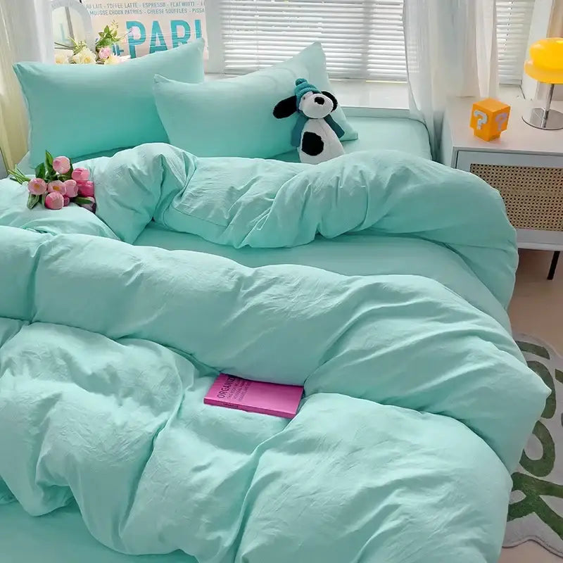 Mint green cotton bedding set with matching pillowcases and a plush dog from DecorBites™ luxurious 4-piece cotton bedding set