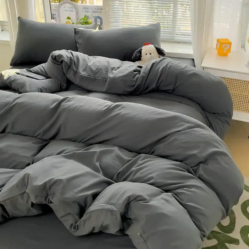 Decorbites™ luxurious 4-piece cotton bedding set featuring a plush dark gray quilt with soft texture and visible stitching