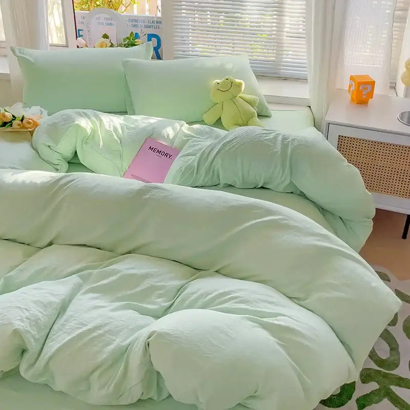 Soft mint green quilted cotton bedding set with plush pillowcases and matching stuffed frog from decorbites