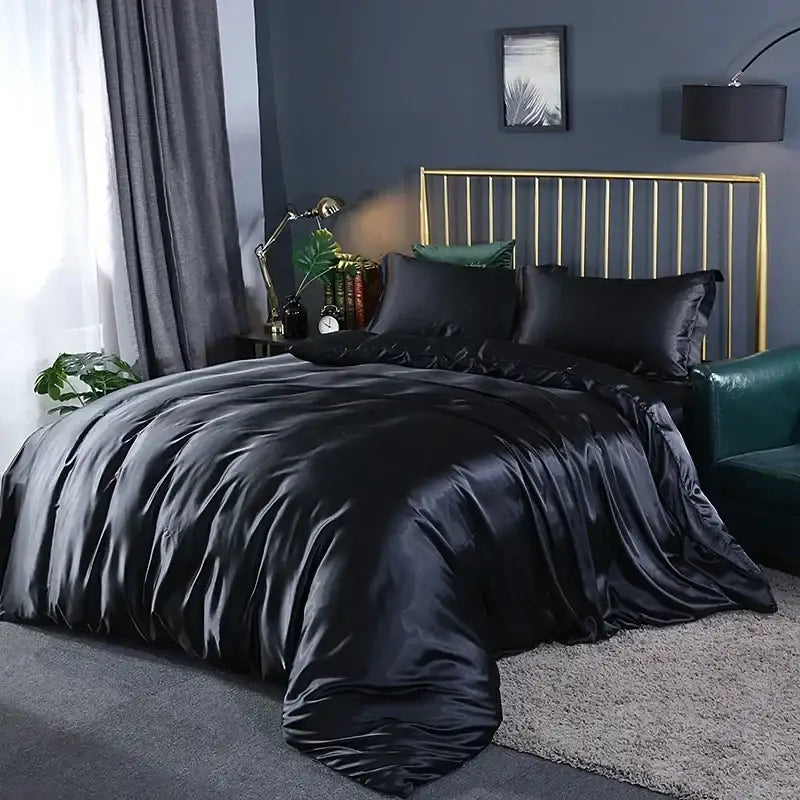 Black satin duvet cover set with matching pillowcases featuring smooth glossy finish and elegant draping pcs suitable
