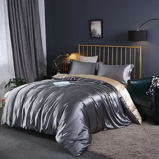 DecorBites™ luxurious bedding set featuring a metallic gray satin duvet cover with subtle gold inner lining draped on bed