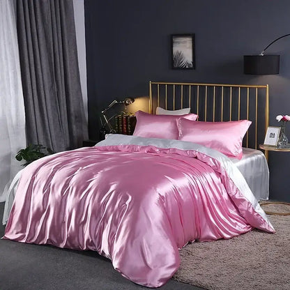 DecorBites™ luxurious bedding set featuring a pink satin duvet cover with matching pillows and silver accent details