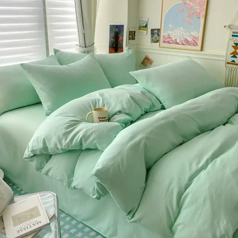 Mint green quilted cotton bedding set with matching pillows and bed skirt from decorbites luxurious collection