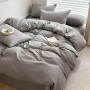 Gray duvet bedding set with matching pillows featuring soft smooth fabric in decorbites™ cotton bedding set