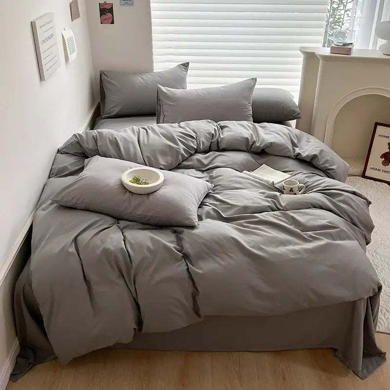 Decorbites™ luxurious gray cotton bedding set with matching pillows featuring a soft slightly wrinkled texture