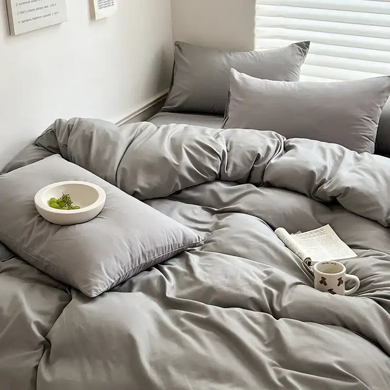 Gray satin-like cotton bedding set by decorbites featuring matching pillows and a plush duvet for luxury comfort