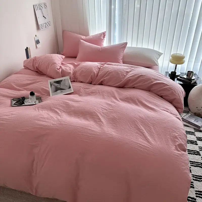 Decorbites™ luxurious pink cotton bedding set with matching pillows featuring a soft slightly wrinkled texture
