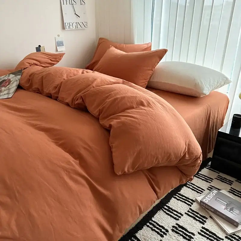 Warm terracotta cotton bedding set with soft texture, including duvet cover and matching pillows by DecorBites™