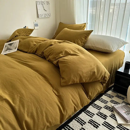 Warm mustard-colored cotton bedding set with soft textured fabric and matching pillows from decorbites luxurious collection