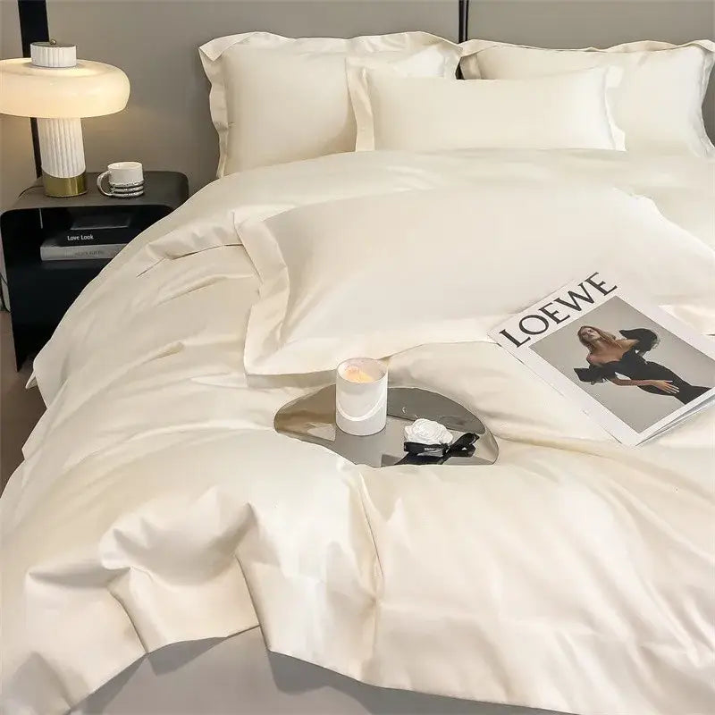 Cream-colored satin decorbites™ 1000tc egyptian cotton bedding set with duvet cover and fitted sheet featuring pleated edges