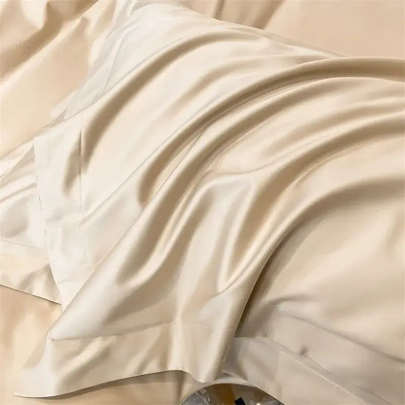 Cream-colored satin pillowcase with smooth glossy texture and elegant folds from decorbites luxurious egyptian cotton bedding set featuring duvet cover and fitted sheet
