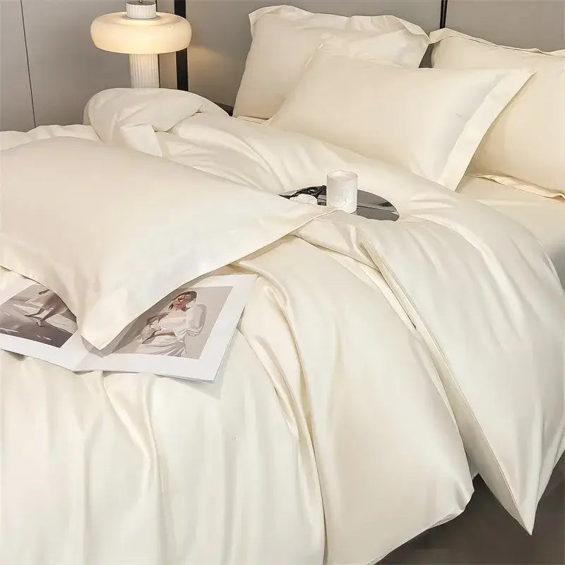 Cream-colored egyptian cotton bedding set with 1000tc satin duvet cover and fitted sheet featuring elegant folds