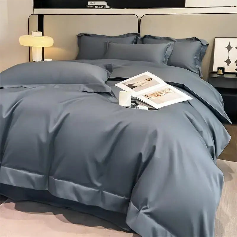 The DecorBites™ luxurious Egyptian cotton duvet cover set features a deep slate blue satin finish with tailored seams