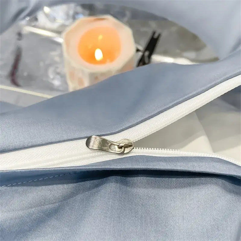 Light blue satin-like duvet cover with white zipper and metallic pull tab in decorbites luxurious egyptian cotton set