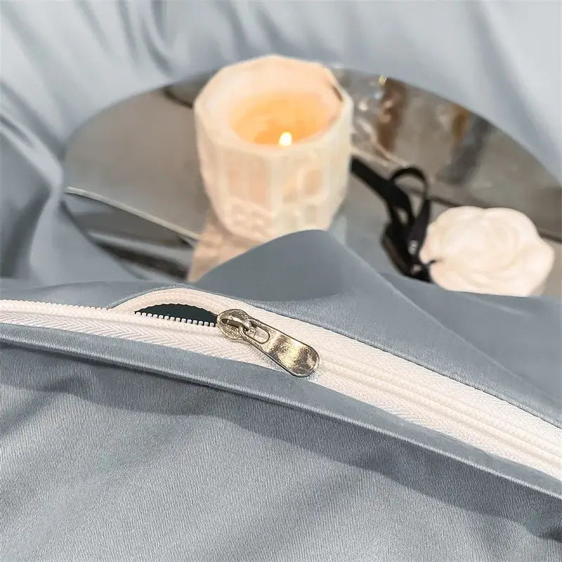 Light blue satin duvet cover with white zipper and metallic pull tab from decorbites luxurious egyptian cotton bedding set 1000tc
