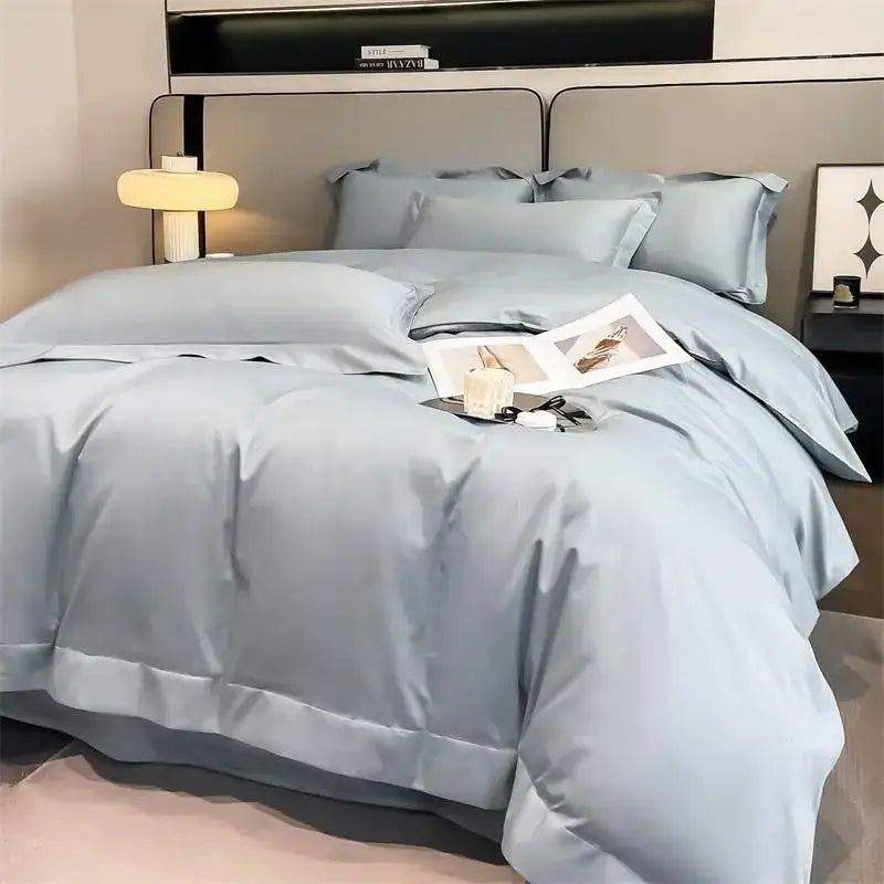 Light blue satin Egyptian cotton duvet cover set with matching pillows and fitted sheet featuring a subtle sheen