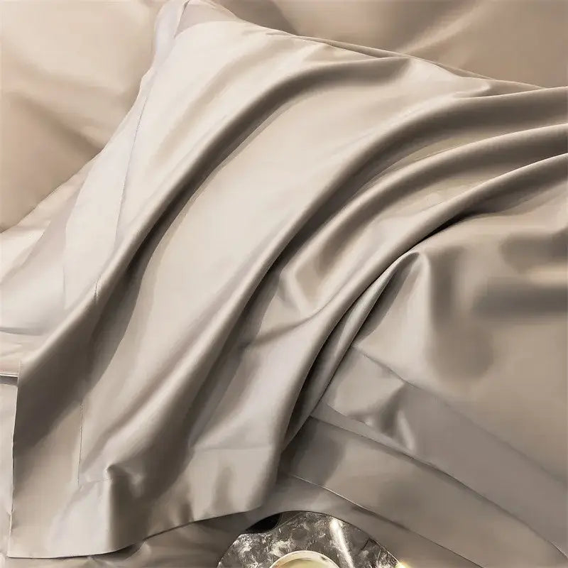 A silver-gray satin pillowcase from decorbites luxurious egyptian cotton bedding set 1000tc with smooth glossy finish and elegant folds