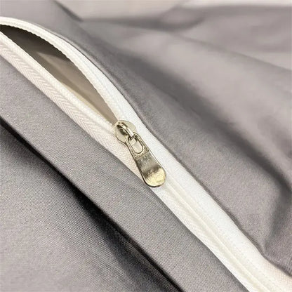 Silver-toned zipper with metallic pull tab on soft gray fabric of decorbites luxurious egyptian cotton duvet cover 1000tc