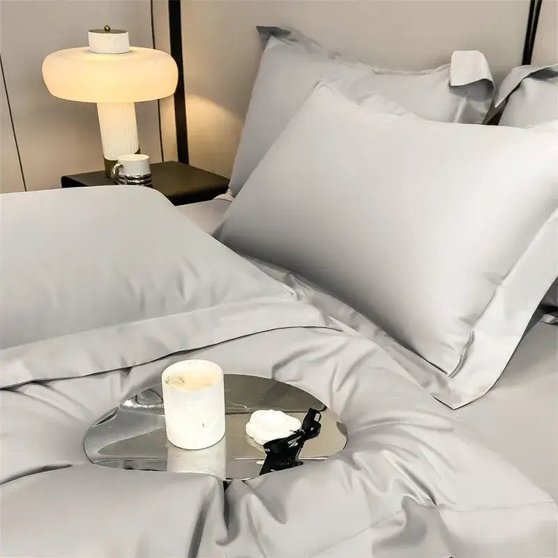 A sleek metallic tray with a white candle complements decorbites luxurious egyptian cotton duvet cover set 1000tc